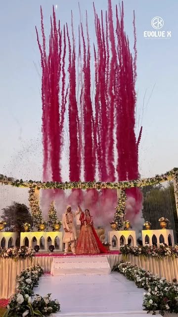 Red colour smoke behind a wedding stage