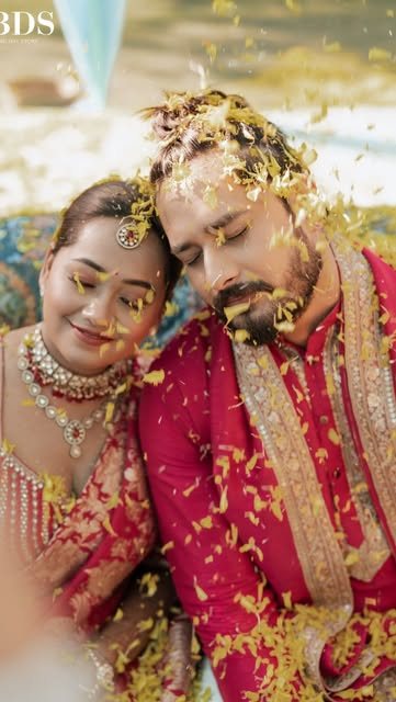 Couple in a shower of marigold petals